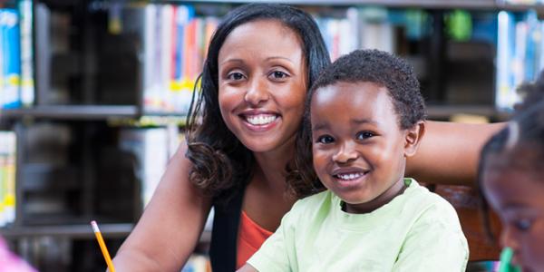 Educator with young child