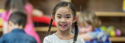 Girl standing in classroom