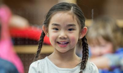 Girl smiles at camera