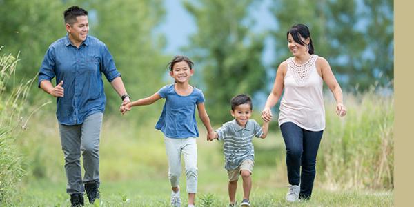 family of four walking oputdoors