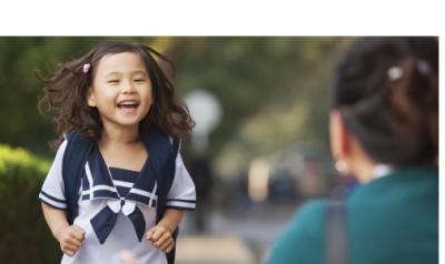 Early childhood girl smiling as she greets someone