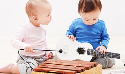 Infants playing instruments