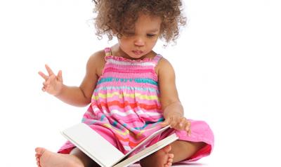 Toddler reading a book