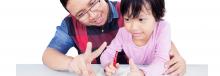 Dad helping daughter with math work