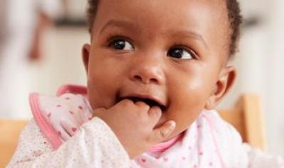 Toddler with hand in mouth