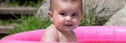 toddler in an outdoor kiddie pool