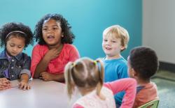 Children talking around a table