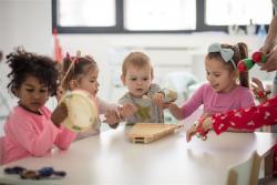 children playing with instruments in a classroom