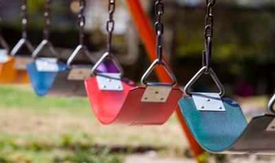 empty swing sets on a playground