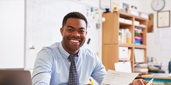 A professional sitting in a classroom 