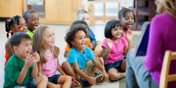 Children smiling and learning during circle time