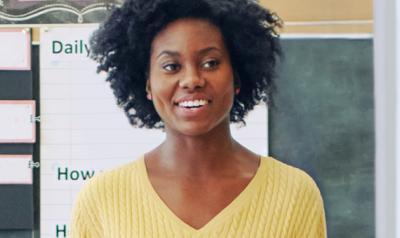 Woman standing in front of a classroom