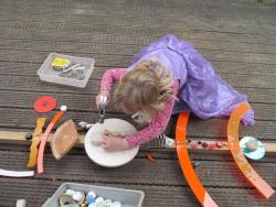 a child working on a wood-based craft