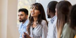 Group of diverse professionals discussing something