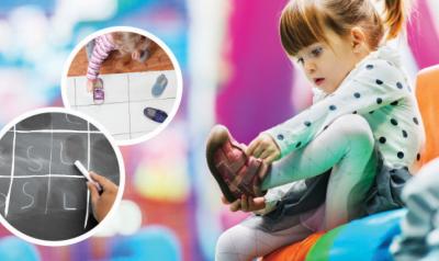 A young child participates in a math activity charting children's types of shoes.