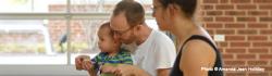 Parents singing with child