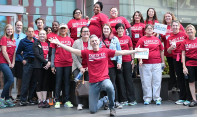 A group of professionals wearing red Early Ed for America shirts