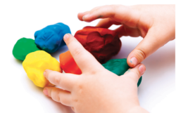 A child's hands with playdough.