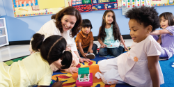 A teacher and her students playing